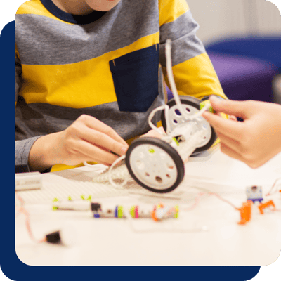 Children putting together a robot