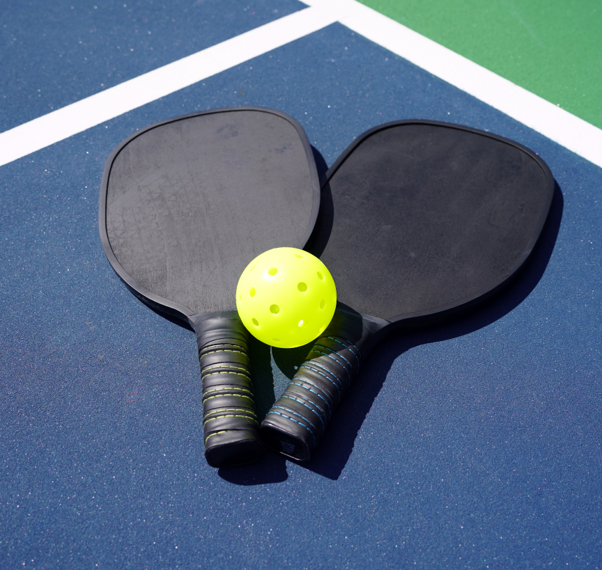 Pickleball racquets on a court