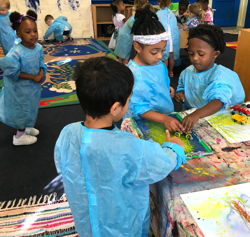 Children painting during art class