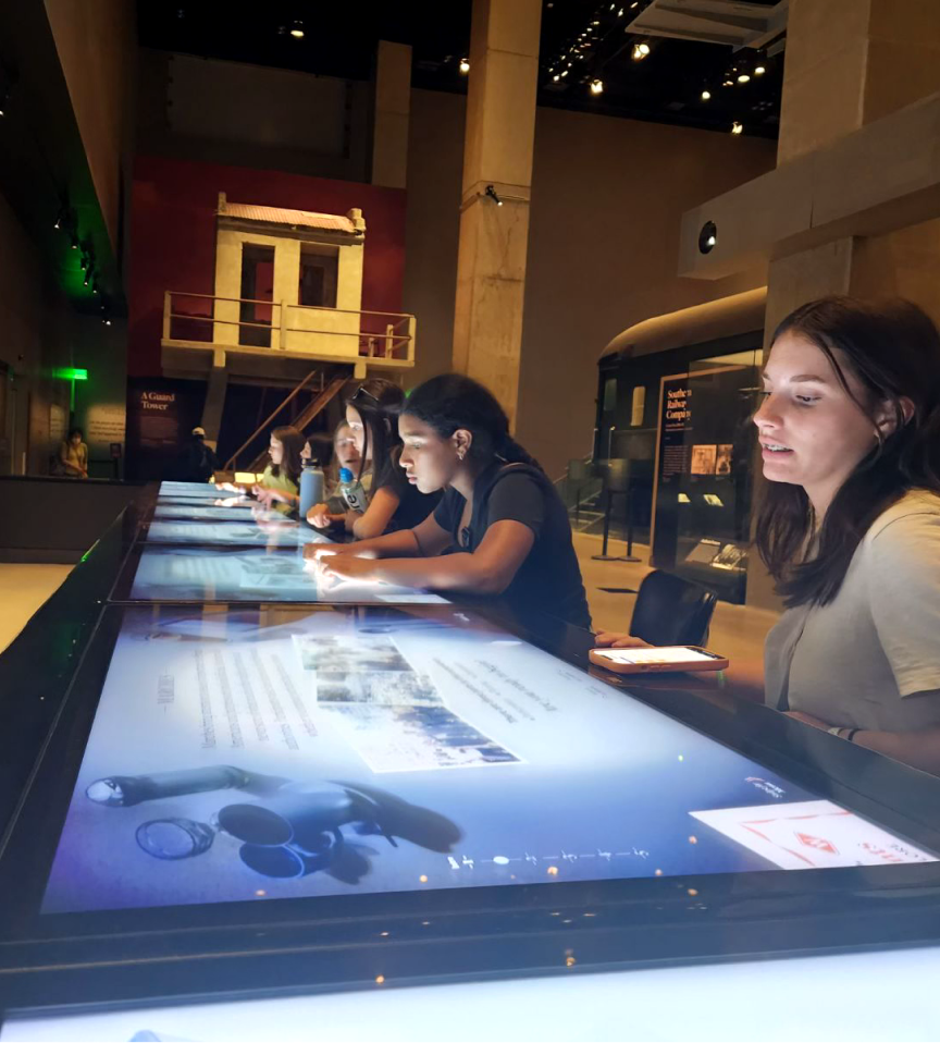 Students learning at a museum during a field trip