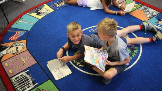 Young students enjoying reading