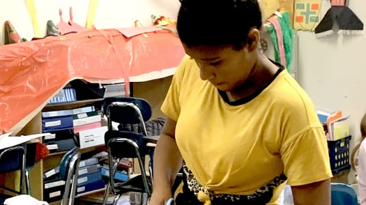 Middle School Student working on a project
